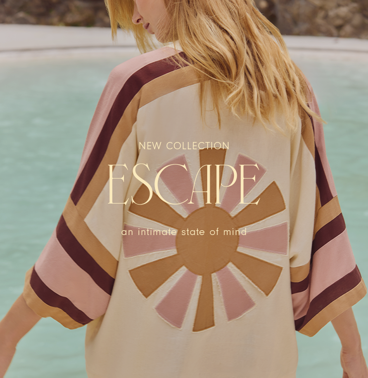 A woman is photographed from behind standing by a light blue pool, wearing a cream garment with wide sleeves in pink, beige, and brown stripes. On the back, there is a large embroidered sunburst motif in beige and soft pink tones. Centered over the image is the text “NEW COLLECTION” above the word “ESCAPE” in large serif letters, followed by the phrase “an intimate state of mind.”