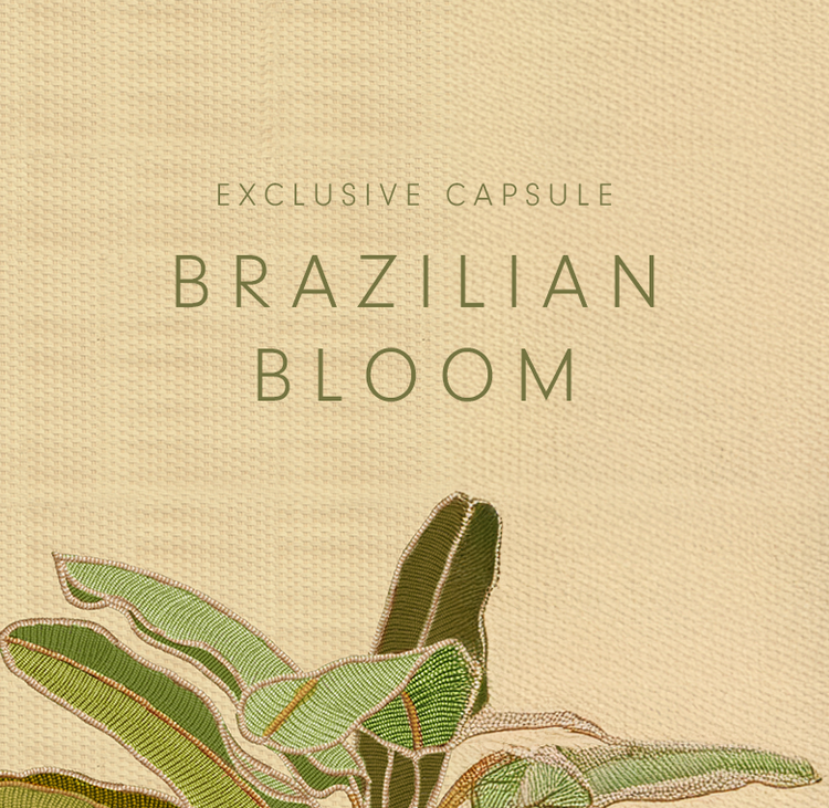 A square graphic on a beige textured background. Text reads "EXCLUSIVE CAPSULE" and "BRAZILIAN BLOOM". At the bottom is an illustration of green banana leaves.
