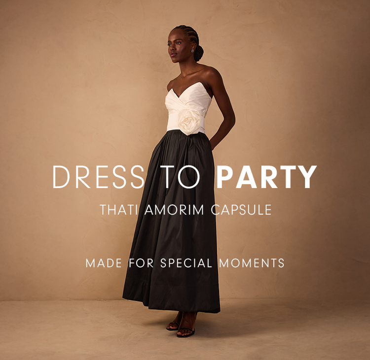 A woman wearing a formal gown with a white strapless top and a full black skirt. To her left is text overlay reading "DRESS TO PARTY", "THATI AMORIM CAPSULE", and "MADE FOR SPECIAL MOMENTS".