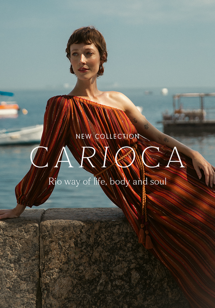 Mobile home page banner: 'NEW COLLECTION CARIOCA - way of life, body and soul.' Features a model in a striped reddish-orange dress posing against a stone wall with a blurred seascape background.