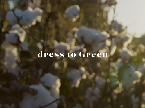 Surrounded by soft, organic textures, the image evokes a quiet connection to nature and conscious creation. The blurred cotton field in the background reinforces a sense of authenticity, care, and natural origin.

“Dress to Green” represents a mindful approach to fashion — where materials, processes, and choices are thoughtfully considered.